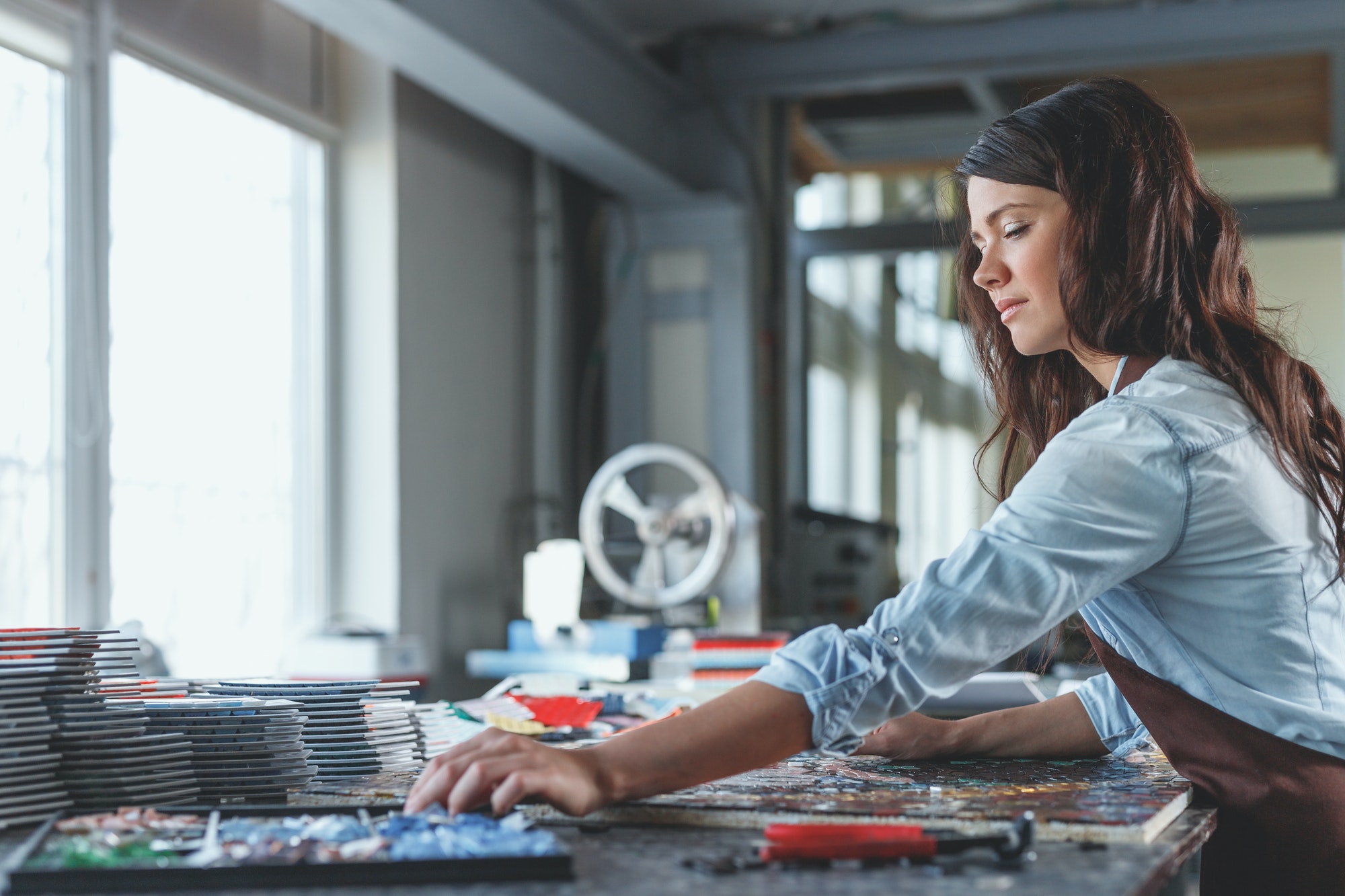 Young woman in workshop